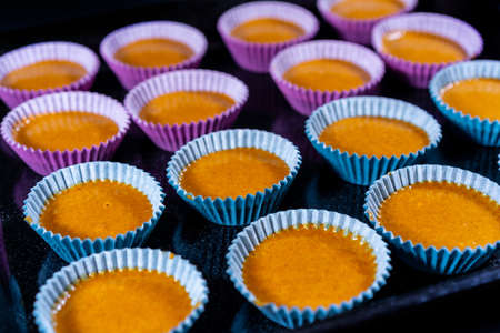 Homemade recipe to cook some carrot muffins at home. Collacadas in the mold before bakingの写真素材