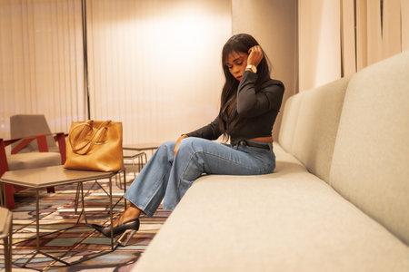 Fashion photo to a beautiful black girl of African ethnic group at a hotel. Enjoying the holidays in...
