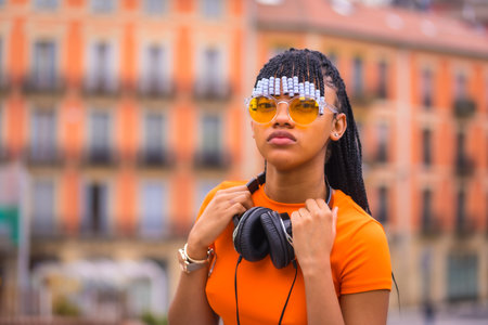 Street Style of a young trap dancer with braids. She pose from the black grinding girl of African...
