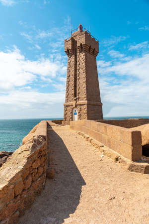 Lighthouse Mean Ruz is a building built in pink granite, port of Ploumanach, in the town of Perros-Guirec in the department of Cotes-d'Armor, in French Brittany, France.の写真素材