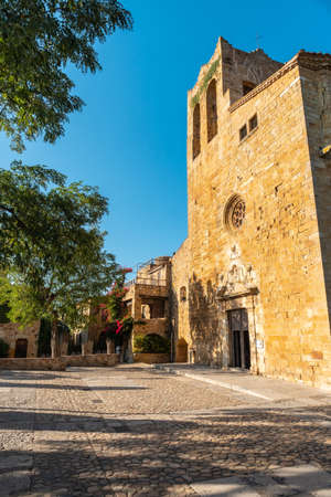 Church of Pals medieval village, streets of the historic center at sunset, Girona on the Costa Brava of Catalonia in the Mediterraneanの写真素材