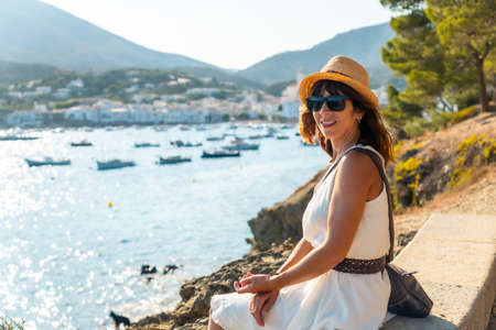 A young woman on summer vacation in Cadaques by the sea, Costa Brava of Catalonia, Gerona, Mediterraneo. Spainの写真素材