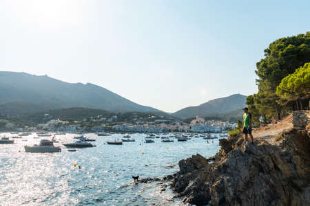 A young man on summer vacation in Cadaques by the sea, Costa Brava of Catalonia, Gerona, Mediterraneo. Spainの写真素材