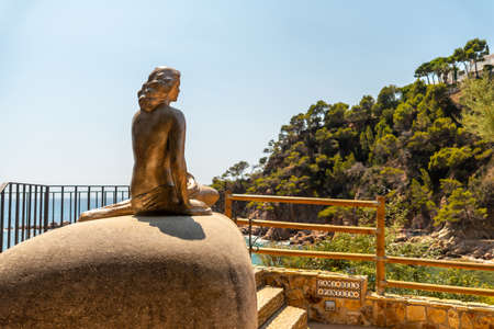 Mermaid sculpture in Cala Canyet next to the town of Tossa de Mar. Girona, Costa Brava in the Mediterraneanのeditorial素材