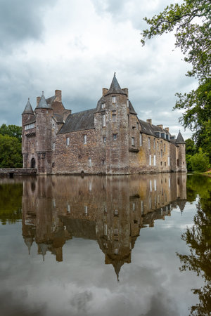 Reflections of the medieval Chateau Trecesson in the lake, CampÃ©nÃ©ac commune in the Morbihan department, near the Broceliande forest.のeditorial素材