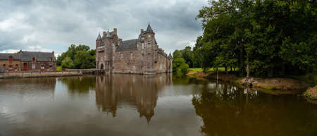 Panoramic of the medieval Chateau Trecesson by the lake, CampÃ©nÃ©ac commune in the Morbihan department, near the Broceliande forest.のeditorial素材