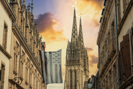 Sunset in the medieval village of Quimper and the Saint Corentin de Quimper Cathedral in the background in the department of Finisterre. French Brittany, Franceのeditorial素材