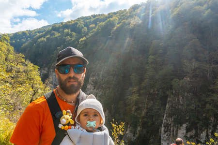A father and his son in the Passerelle Holtzarte, Larrau. In the forest or jungle of Irati, north of Navarra in Spain and the Pyrenees-Atlantiques of Franceの写真素材