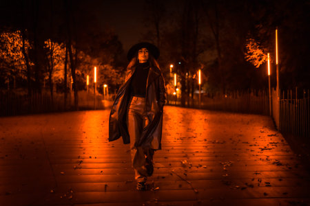 Girl with a hat walking calmly through a park on a winter night