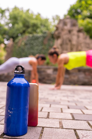 Latin girl doing sports in a park in the city, lifestyle a healthy life, recording a video for...