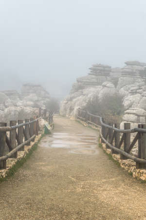 Fog on the trail at the top of Torcal de Antequera, in the municipalities of Antequera and Villanueva de la ConcepciÃ³n. Province of Malaga, Andalusiaの写真素材