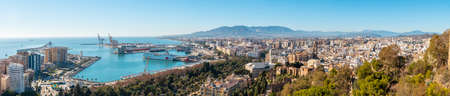 Panoramic of the city, the town hall and its gardens and the port from the Gibralfaro Castle in the city of Malaga, Andalusia. Spainの写真素材