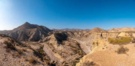 Panoramic in the curve of the path of the desert canyon of Tabernas, province of AlmerÃ­a, Andalusia. On a trek in the Rambla del Infiernoの写真素材