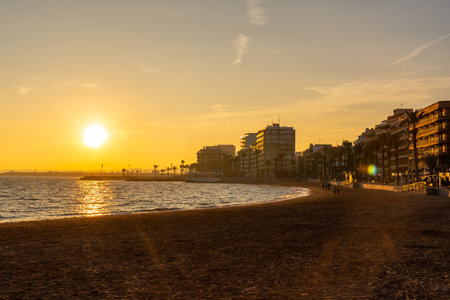 Sunset at Playa del Cura in the coastal city of Torrevieja, Alicante, Valencian Community. Spain, Mediterranean Sea on the Costa Blancaの写真素材