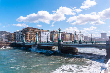 Rio Urumea and his precious bridge in the city of San Sebastian. Panoramic view of the tourist city a spring morning. Gipuzkoa, Basque Countryの写真素材