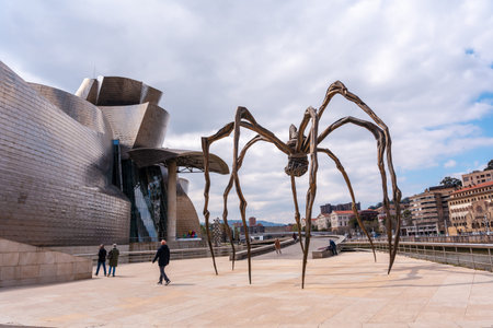Spider sculpture next to the Guggenheim museum in the city of Bilbao on a cloudy spring morning, Vizcaya. basque countryのeditorial素材