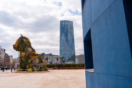 Flower dog called Puppy next to the Guggenheim museum in the city of Bilbao on a spring morning,...