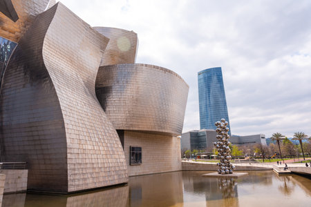 Ball sculpture next to the Guggenheim museum in the city of Bilbao on a cloudy spring morning, Vizcaya. basque countryのeditorial素材