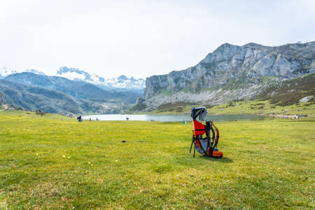 A backpack to transport babies in Lake Ercina in the Lakes of Covadonga. Asturias. Spainの写真素材