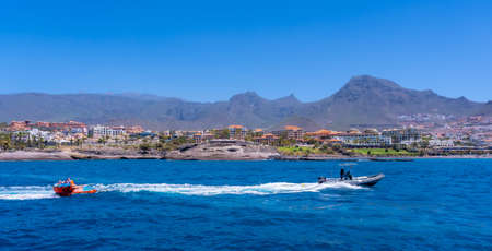 Tourists having fun on a boat on the Costa de Adeje in the south of Tenerife, Canary Islandsの写真素材