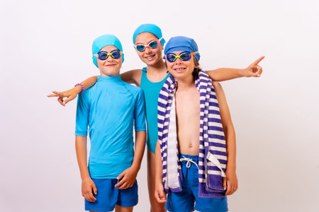 Portrait of brothers dressed in swimsuits for swimming lessons in the pool. white backgroundの写真素材