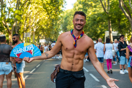 Madrid, Spain: July 9, 2022: A young man having fun at the gay pride party, lgbt in Madrid, rainbow...