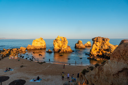 Beach in summer with people, holidays at Praia dos Arrifes, Algarve, Albufeira. Portugalの写真素材
