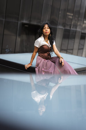 Asian girl wearing vintage asian traditional long dress, sitting fashion concept