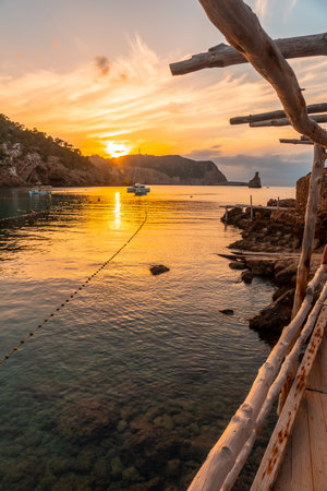 Coast at sunset on the beach at sunset in Benirras in Ibiza. holiday conceptの写真素材