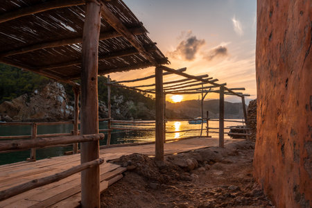 Wooden structure in the beach houses at sunset in Benirras in Ibiza. holiday conceptの写真素材