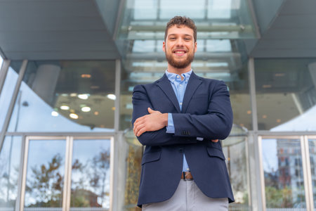 Portrait businessman CEO of a company at glass office entrance, finance conceptの写真素材