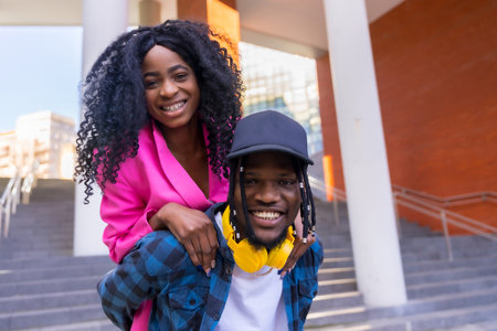Young african american women in the city, friends lifestyle, overhead portrait of guy smilingの写真素材