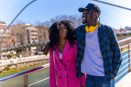 Young african american women in the city, lifestyle of friends, walking embraced