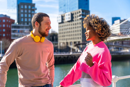 Multiracial friends on the streets of the city, lifestyle concept, talking by the river