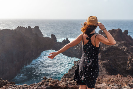 El Hierro Island. Canary Islands, a young tourist visiting the Arco de la Tosca. monument on the...