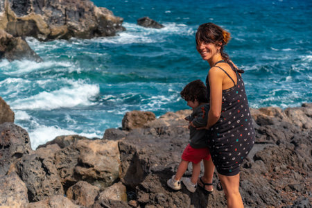 Mother and son on a footpath at the Muelle de Orchilla on the southwest coast of El Hierro. Canary Islandsの写真素材