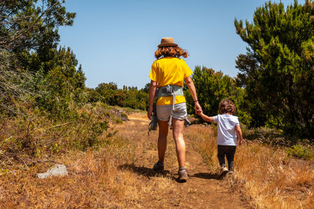 A mother with her son on a hiking trail in La Llania on El Hierro, Canary Islandsの写真素材