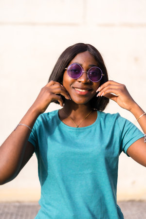 Summer in the City: Beautiful Black Tourist Woman in Green T-Shirt and Shadesの写真素材