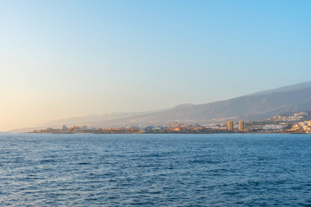 Tenerife ferry heading to Hierro or La Gomera. View from the boat of Los Cristianos and the island of Tenerifeの写真素材