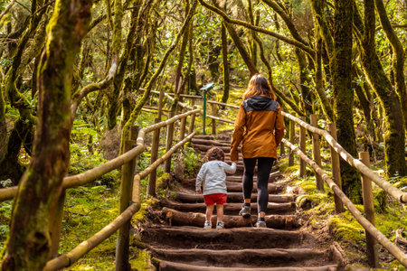 Mother and son hiking on a path in the Garajonay natural park on La Gomera, Canary Islandsの写真素材