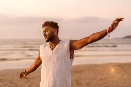 Portrait of black ethnic model enjoying summer vacation by the sea feeling free