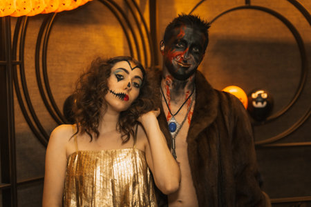 Halloween party with friends in a disco nightclub, portrait of a couple in costumes