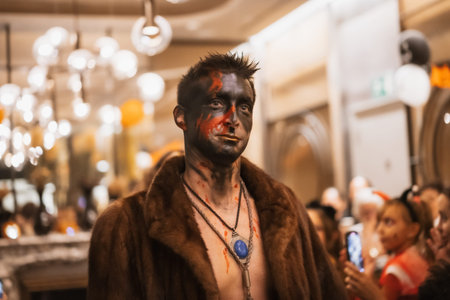 Portrait of a man at the halloween party with friends in a disco nightclub