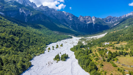 Aerial drone view of Valbona valley and dry river in summer, Theth national park, Albanian Alps, Albania.の写真素材