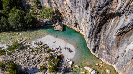 Aerial drone view of small beach on turquoise river of Valbona valley, Theth national park, Albanian Alps, Albaniaの写真素材