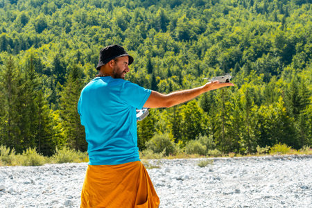 Drone pilot man taking off the drone on the mountain in Valbona natural park. Albanian