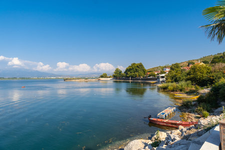 Views of Shiroka Lake with boats near Shkoder in summer. Albania