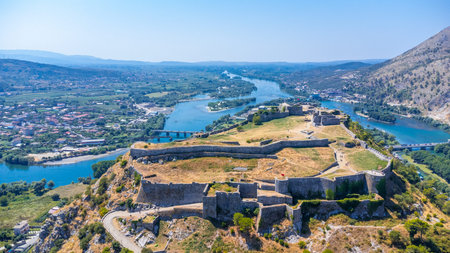 Aerial drone view of Rozafa Castle in the city Shkoder and its walls next to the lake and the river. Albaniaの写真素材
