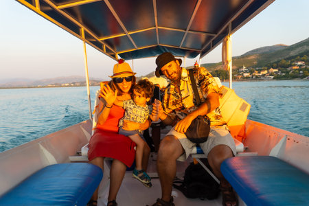 A family on a boat on a sightseeing excursion on Lake Shkoder in Shiroka. Albania