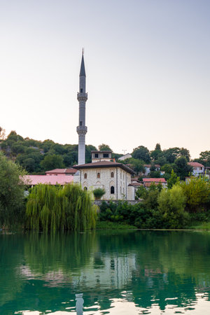 View of Kisha Katolike Eternit Capucin from a boat on a sightseeing excursion on Lake Shkoder in Shiroka. Albaniaの写真素材